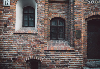 Red brickwall facade in ancient european style