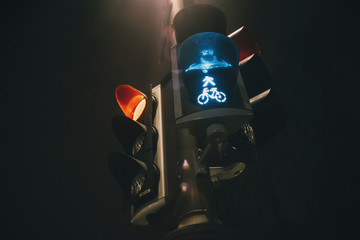 Traffic light with green bycicle color at dusk