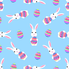 Cute Easter bunny holds paschal egg in its paws seamless pattern.