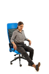 Woman doing exercises while sitting on the office chair, isolated on white