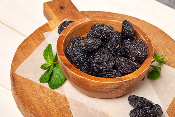 Prunes with green leaf. Close Up. 
