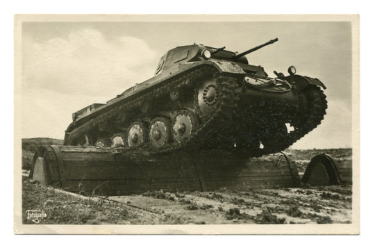 Old German postcard-black and white photo: "Our Wehrmacht" series: PzKpfw II tank overcomes an obstacle at the training ground. world war II, Germany, third Reich