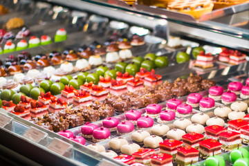 Two Pastries (dolci) In A Glass Counter In an Italian Pastry Shop (pasticceria) In Rome, Italy.