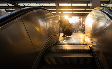 Escalators stairs going up and warm sunrise light © YesPhotographers