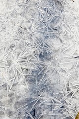 White ice and snow at ice rink as background