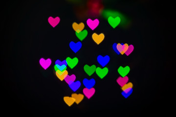 Heart bokeh background, Love and Valentine day concept. Multicolored Shiny hearts light
