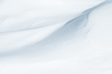 Obraz premium Fresh snow background texture. Winter background with snowflakes and snow mounds. Snow lumps.