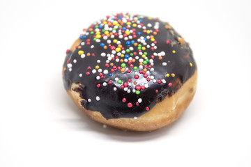 Donut with sprinkles on a white background.