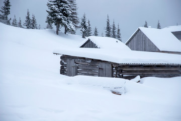 Fototapeta na wymiar Snowy house in the mountains