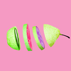 Fruit slices sliced green pear abstract minimalist design with purple red green fruit on pink background Creative concept