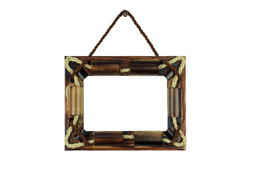 copy spaсe, wooden photo frame with patterns of threads and knots, hanging on a nail, isolate