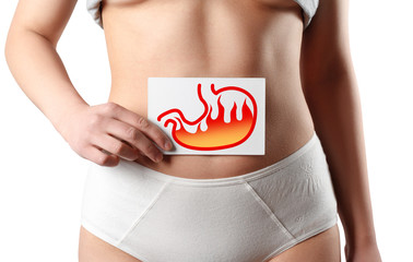 Acid reflux or Heartburn, stomach is on the woman's body gray Background, anatomy concept isolated...