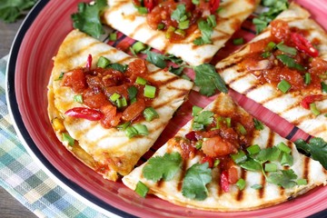 Quesadilla grill with spicy salsa with chili pepper. Mexican traditional food, wheat tortillas. 