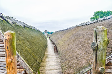 Fototapeta premium Corridor between the two main wooden huts of the Biskupin ancient village, Poland