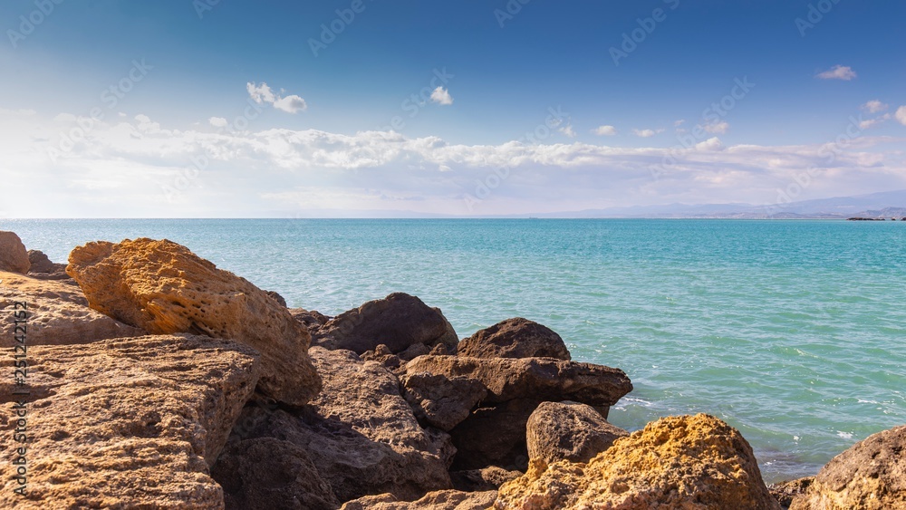 Wall mural rocks and sea blue sky 