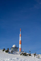 top of Brocken mountain, snow covered winter landscape on highest mountain in Saxony Anhalt, Germany