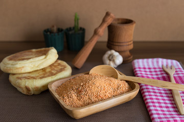 Tarhana soap in the wooden plate with traditional spoon and garlic for kitchen and food photo concept.