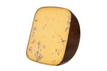 Big piece of cheese with nuts isolated on white background