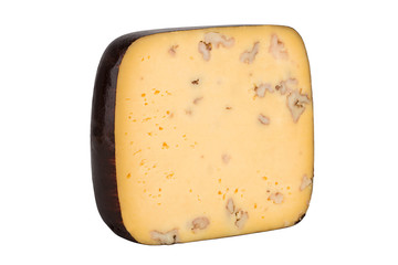 Big piece of cheese with nuts isolated on white background