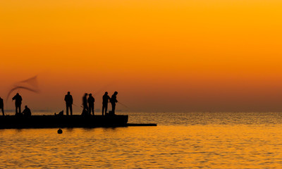 Fishermen catch fish at sunrise