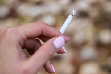 Young woman enjoying a cigarette