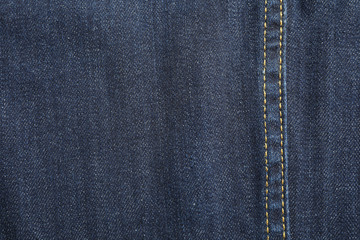 Naklejka premium Texture of blue jeans as background, space for text