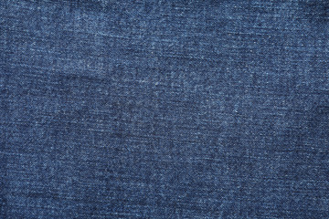 Fototapeta na wymiar Texture of blue jeans as background, space for text