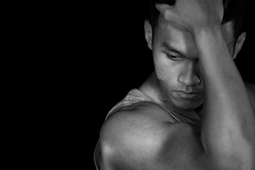 Asian muscle men on the black background in black and white