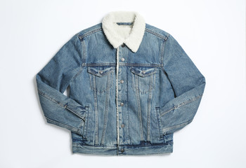 Denim jacket on white background, top view