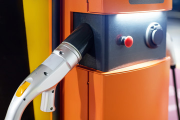 Electric car fast charging station at indoor underground parking. Power supply point network for...