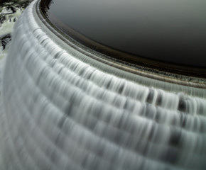 Smooth flow of water cascading down a dam from a reservoir. New Croton Dam New York. 