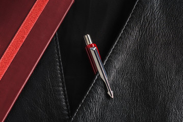 red parker pen in jacket