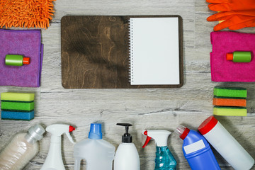 concept plan for cleaning service. Notebook and sponge cleaner tools, fluids, tools	