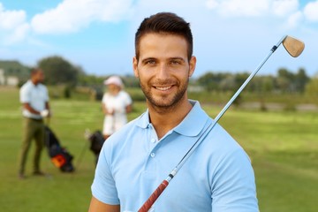 Closeup portrait of handsome golfer