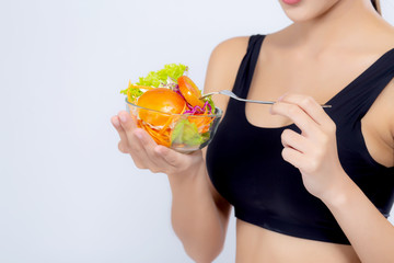 Closeup asian woman holding and eat salad vegetable food isolated on white background, girl diet eating vegetarian for healthy, health care or wellness concept.