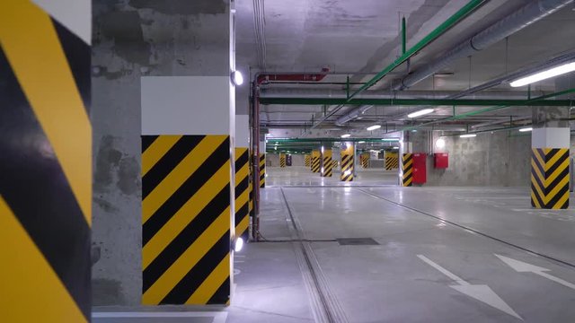 Empty underground parking garage. Cars