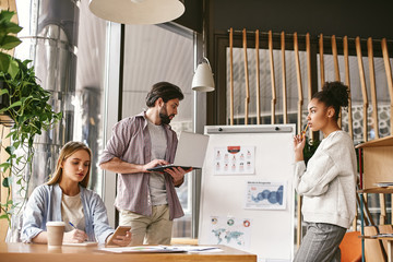Fototapeta premium Individual commitment to a group effort – that’s what makes a team work, a company work, a society work, a civilization work. Colleagues are working over a project together