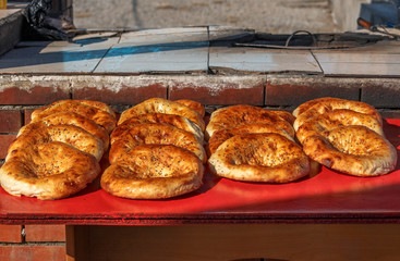 Central Asian tortillas on a street counter near the tandoor.