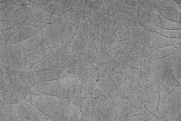 Old worn and cracked asphalt with cracks, roofing material, cement, concrete