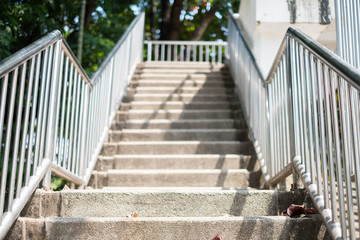 Step up the stairs and walk on the overpass