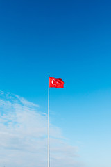 Turkish flag waving at blue sky. Turkey country flag flowing in the wind at blue sky. 