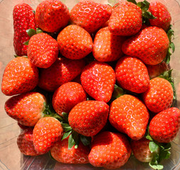 natural and fresh red strawberries on a table ready to eat