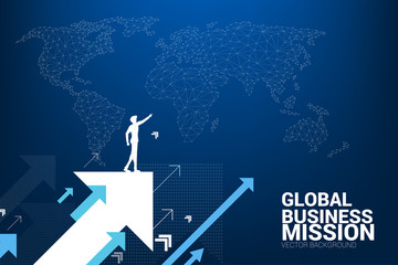 Silhouette of businessman point forward on moving up arrow with world map background. concept of growth business and leadership.