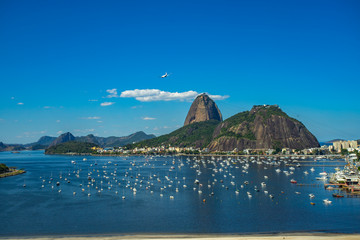 Exotic mountains. Famous mountains. Mountain of the Sugar Loaf in Rio de Janeiro, Brazil South America. Panoramic view of boats and yachts in the marina.  - obrazy, fototapety, plakaty
