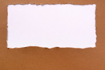 Torn brown paper background frame oblong