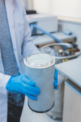 Researcher, scientist, physicist or laboratory assistant working, experimenting and analyzing in modern lab with liquid nitrogen
