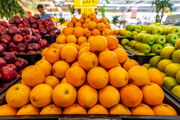 Fresh navel orange fruits pile for market place. Bali island, Indonesia.
