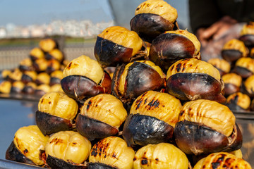 Turkish street food, roasting chestnut grill. Close up