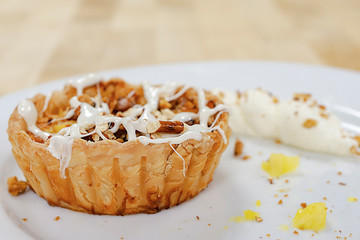 A marshmallow pretzel tart close up.  Garnished with pineapple bits.