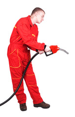 Man gas station staff  is holding red gasoline pistol pump fuel nozzle